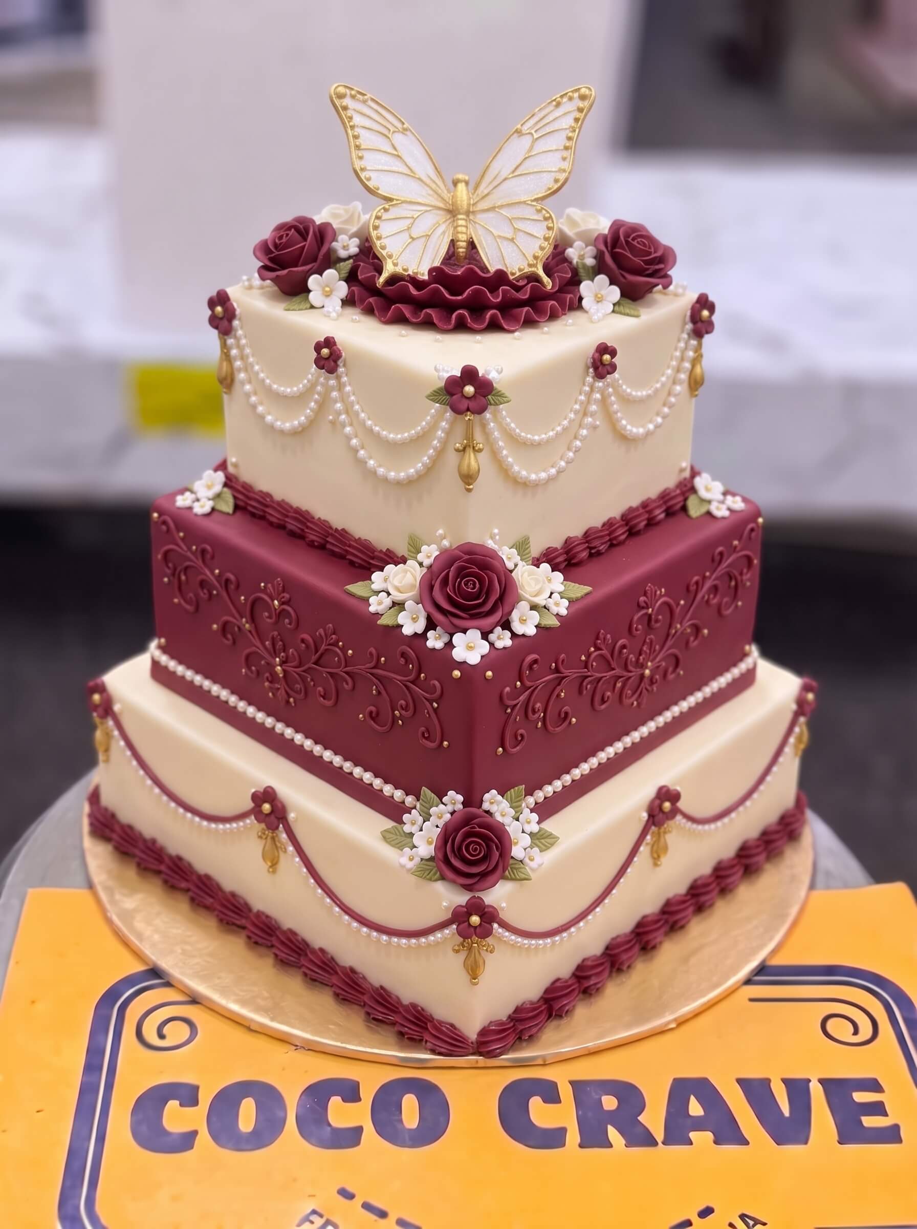 Maroon and Ivory Butterfly Wedding Cake in Lahore — photo 2 by CocoCrave.pk Maroon and Ivory Butterfly Wedding Cake in Lahore — photo 2