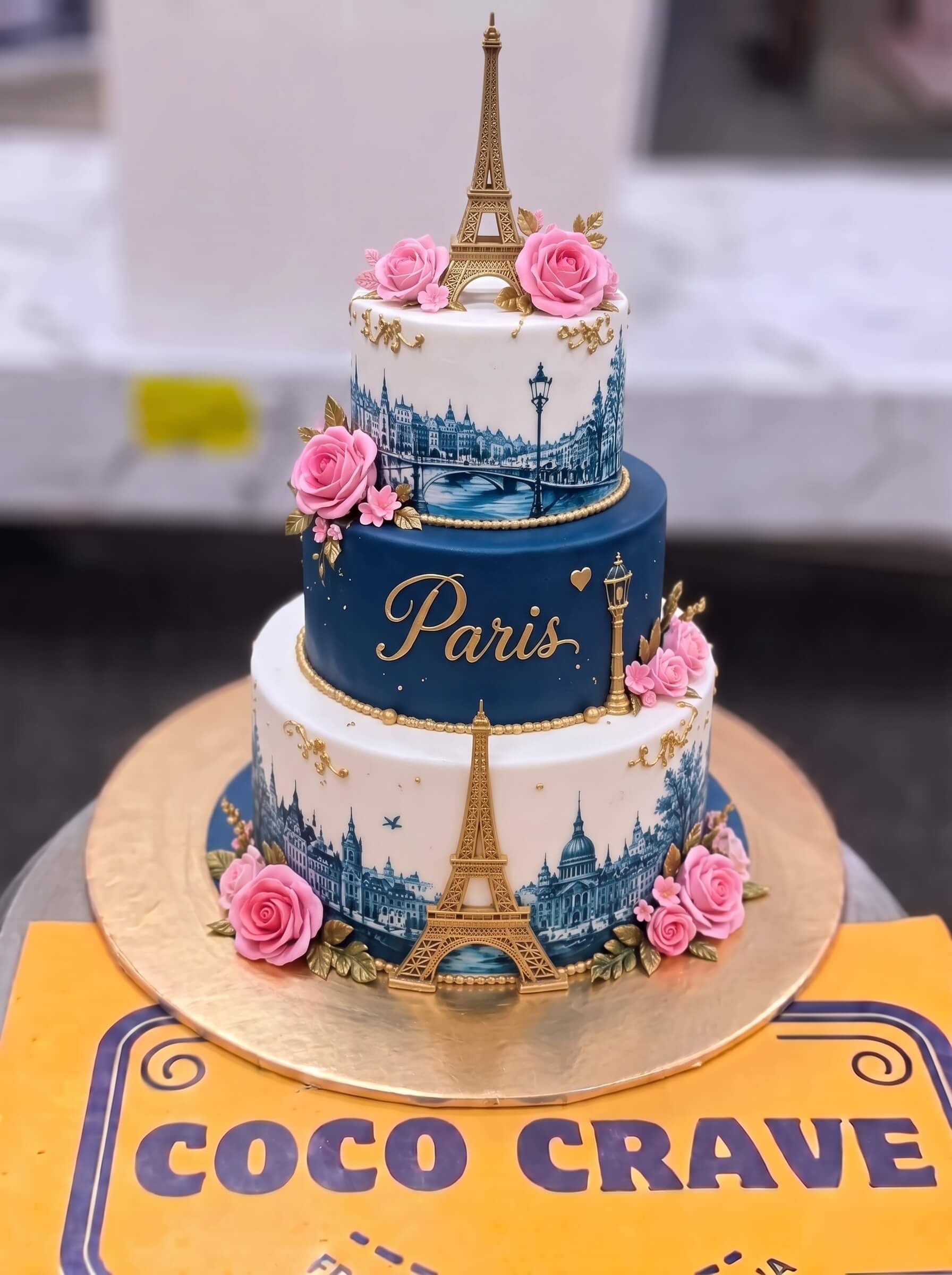 Paris Blue and White Three Tier Cake in Lahore by CocoCrave.pk Paris Blue and White Three Tier Cake in Lahore