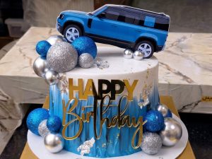 Red Car Cake by Coco Crave — premium red car cake delivered in Lahore