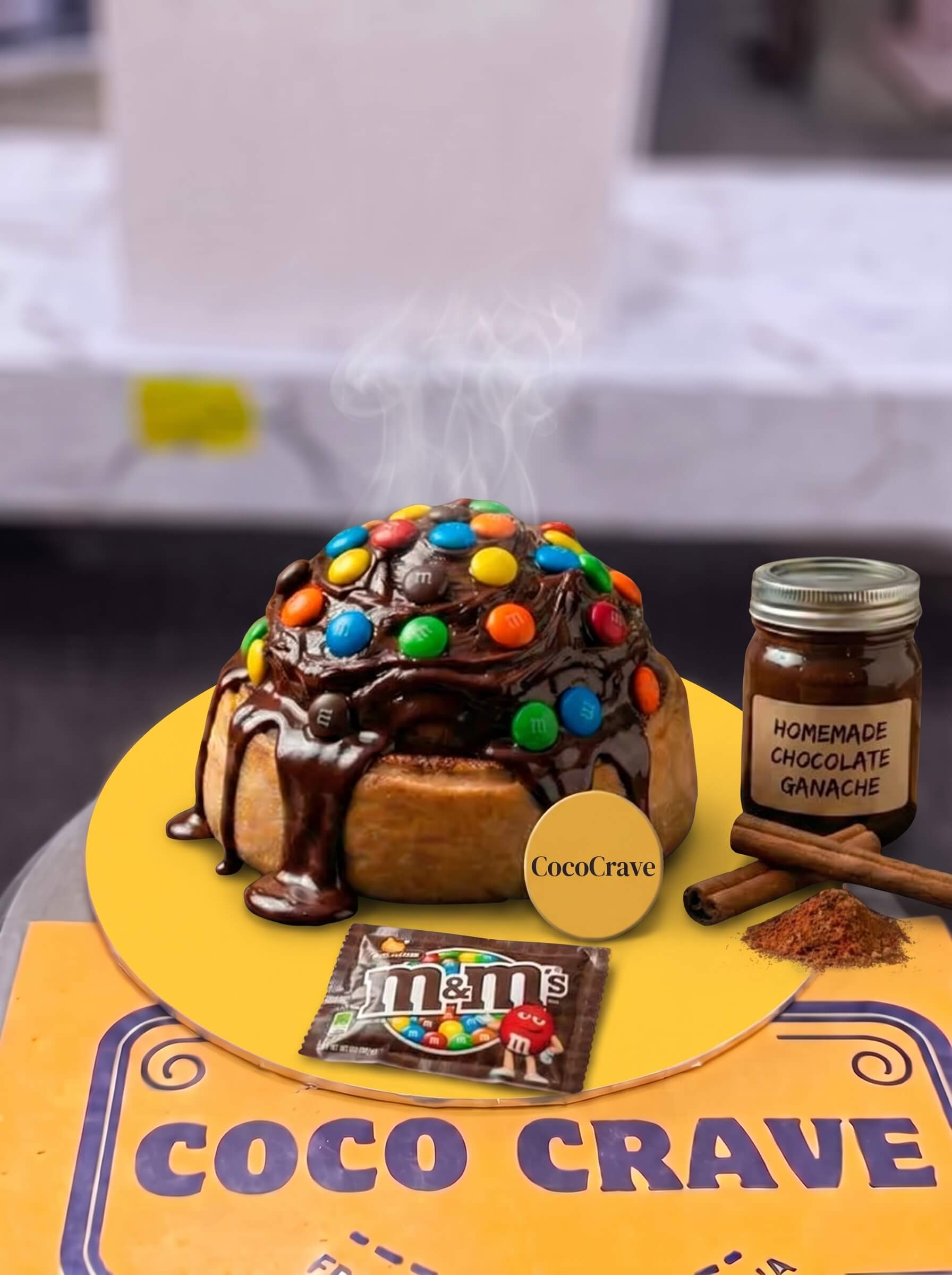 Chocolate and M&Ms Loaded Cinnamon Roll in Lahore | CocoCrave.pk Chocolate and M&Ms Loaded Cinnamon Roll in Lahore by CocoCrave.pk