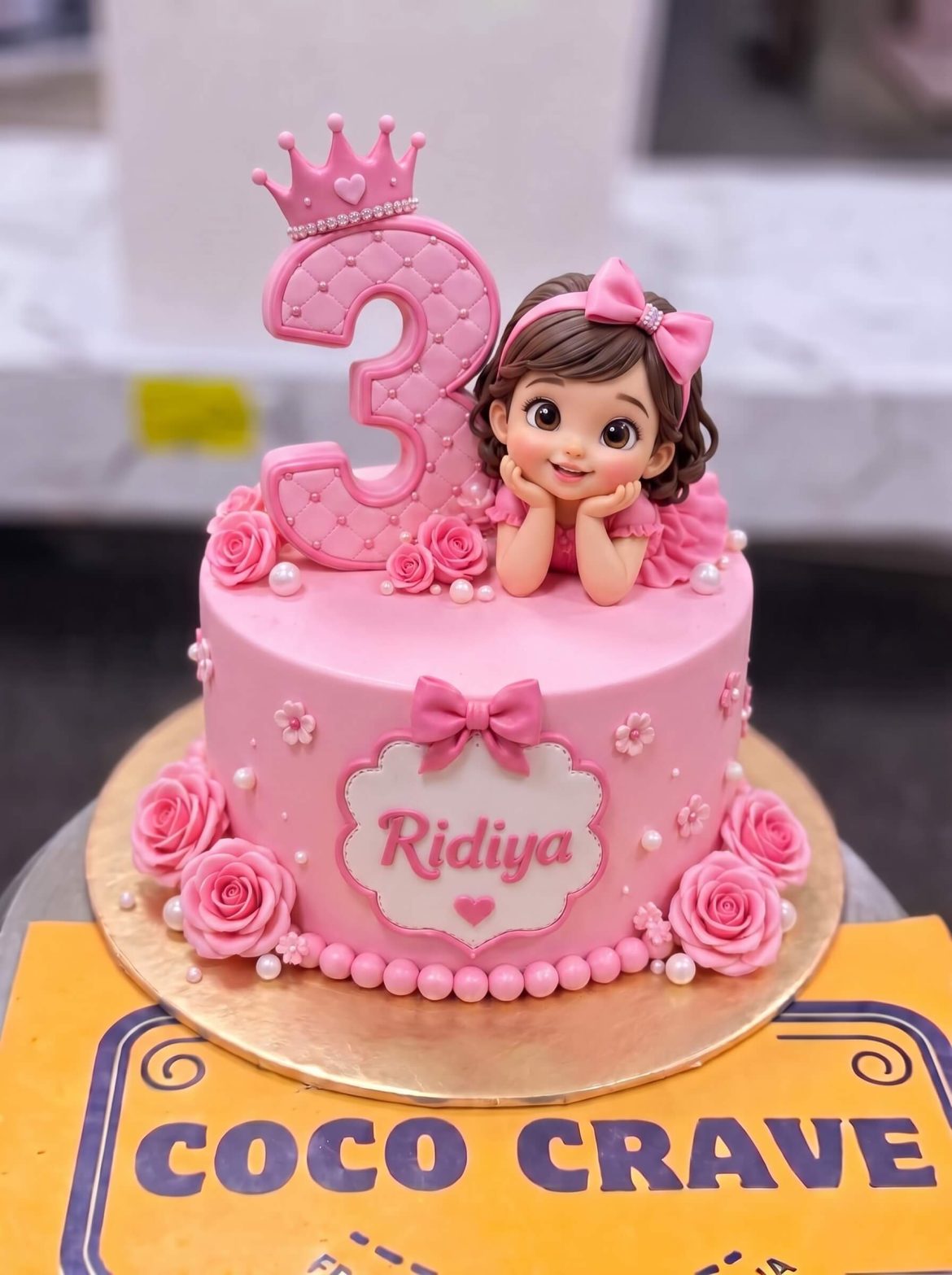 Barbie Girl 3rd Birthday Cake in Lahore — A soft pink birthday cake for a little girl — a sweet doll figurine resting on top beside a glitter age number