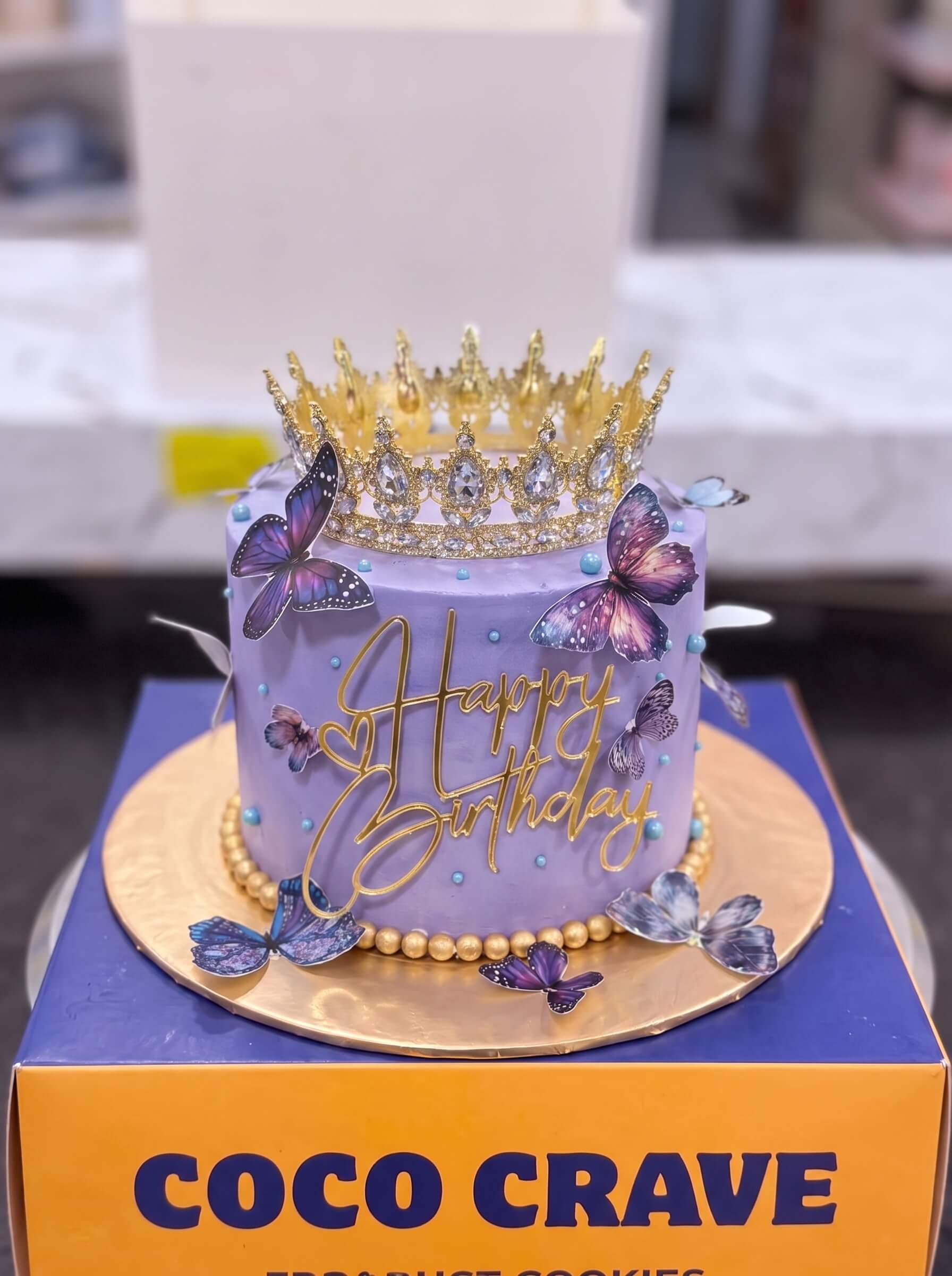 Edit_cake_image_placement_2K_202609060425 Lilac Butterfly Crown Cake in Lahore — Cococrave Lahore