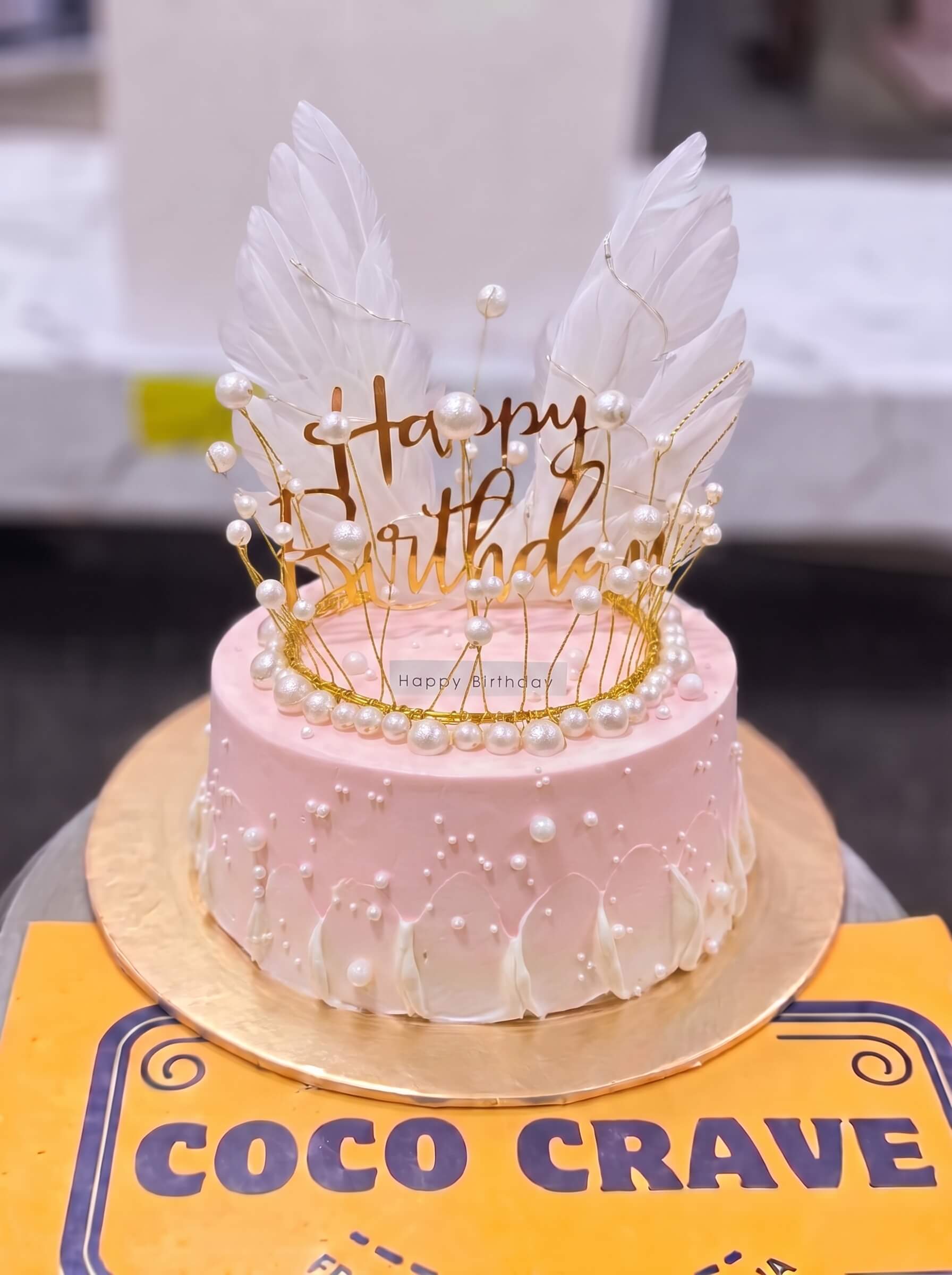 Edit_cake_images_and_move_2K_202609060425 Pearl Feather Crown Cake in Lahore — Cococrave Lahore