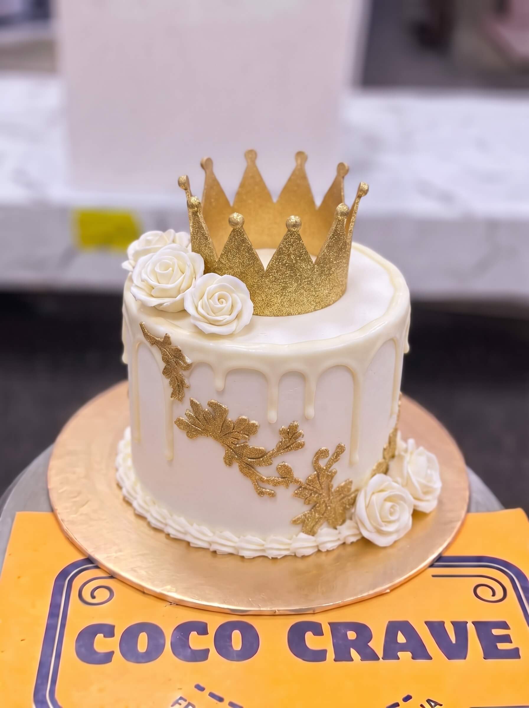 Edit_cake_images_and_remove_2K_202609060422 (2) White Rose Gold Drip Crown Cake in Lahore — Cococrave Lahore