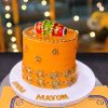 Orange Gold Beaded Mayoun Cake in Lahore — An orange mayoun cake covered in hand-placed gold beading — hundreds of individual pearls set one at a time.