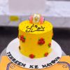 Yellow Rose Calligraphy Mayoun Cake in Lahore — Yellow sugar roses clustered on one shoulder of the cake, with Urdu calligraphy written across the open space