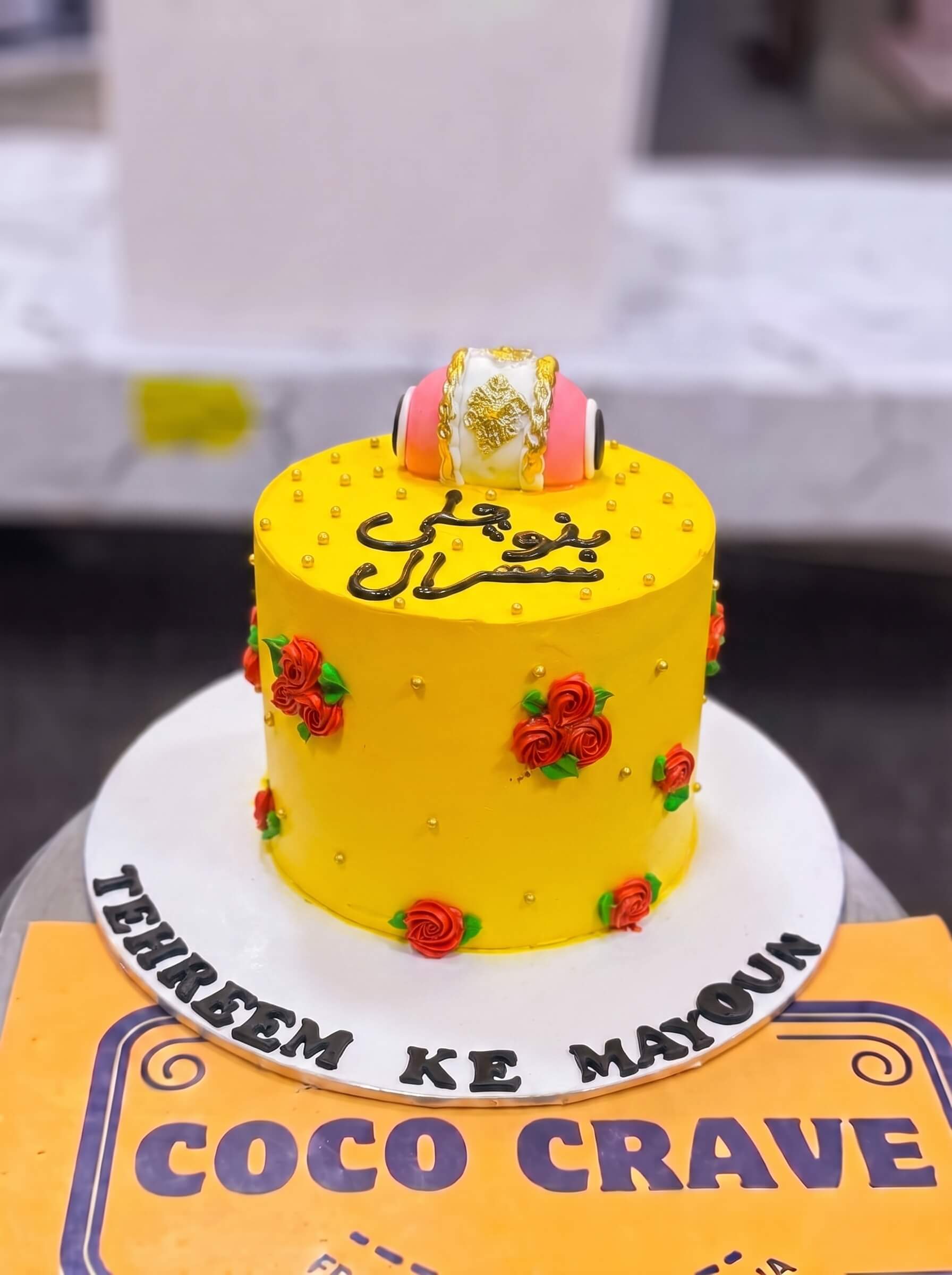 Yellow Rose Calligraphy Mayoun Cake in Lahore — Coco Crave Lahore Yellow Rose Calligraphy Mayoun Cake in Lahore — Yellow sugar roses clustered on one shoulder of the cake, with Urdu calligraphy written across the open space