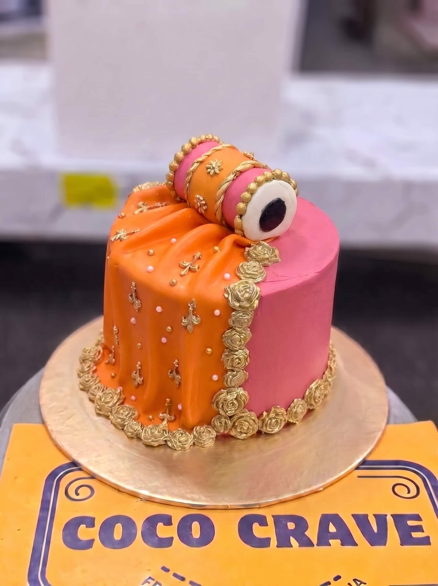 Orange & Pink Chooriyan Mehndi Cake in Lahore — Coco Crave Lahore Orange & Pink Chooriyan Mehndi Cake in Lahore — Orange and pink sugar chooriyan stacked around a mehndi cake — bangles you can actually eat, in the two loudes