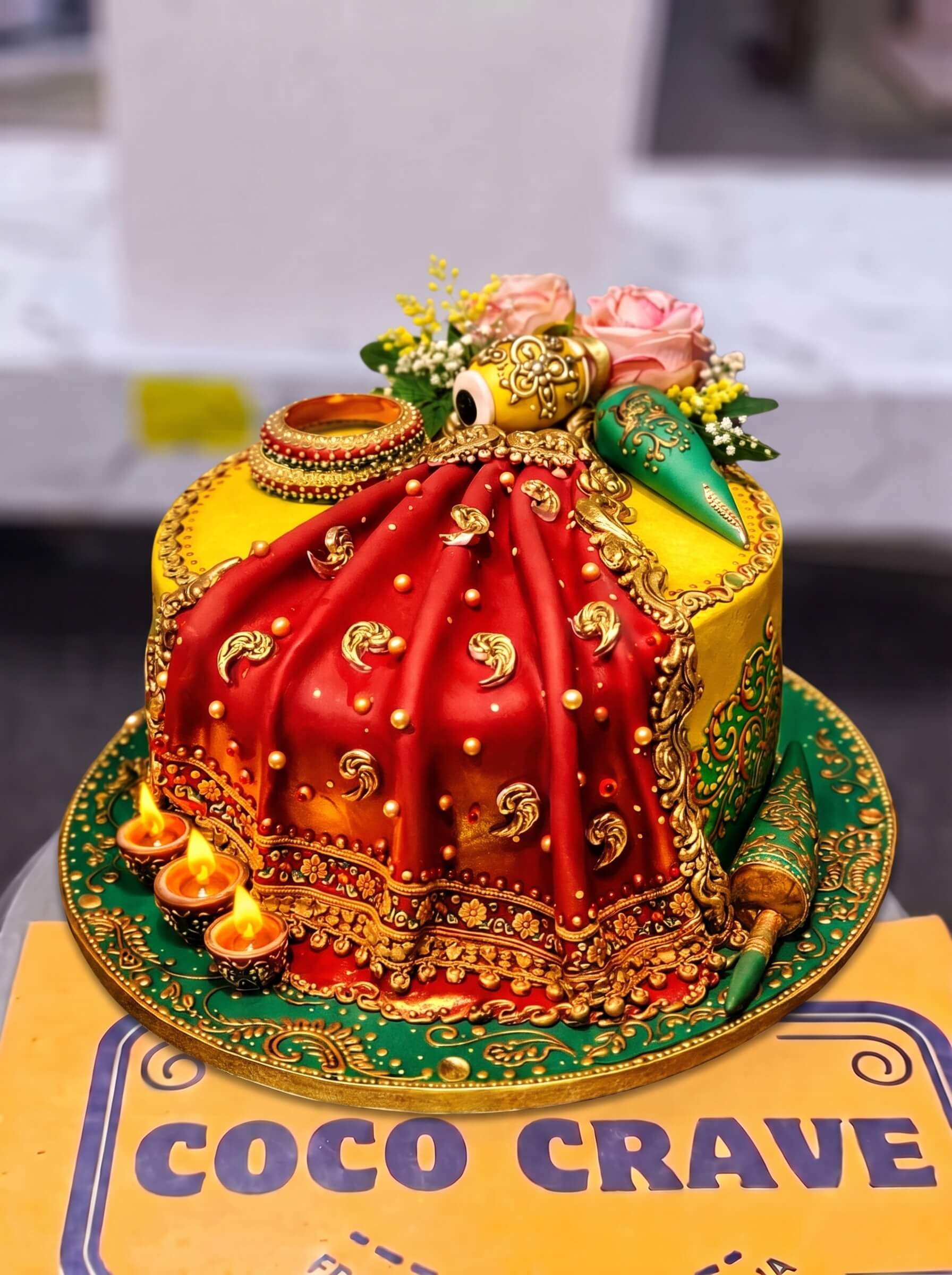 Red & Gold Doli Wedding Cake in Lahore — Coco Crave Lahore Wedding Cakes by Coco Crave — premium wedding cakes delivered in Lahore