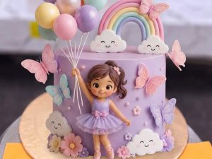 Barbie Balloon and Rainbow Cake in Lahore — A lilac cake with a ballerina doll holding a cluster of pastel balloons, a fondant rainbow, clouds and butterf
