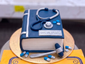 Blue Doctor Scrubs and Stethoscope Cake in Lahore