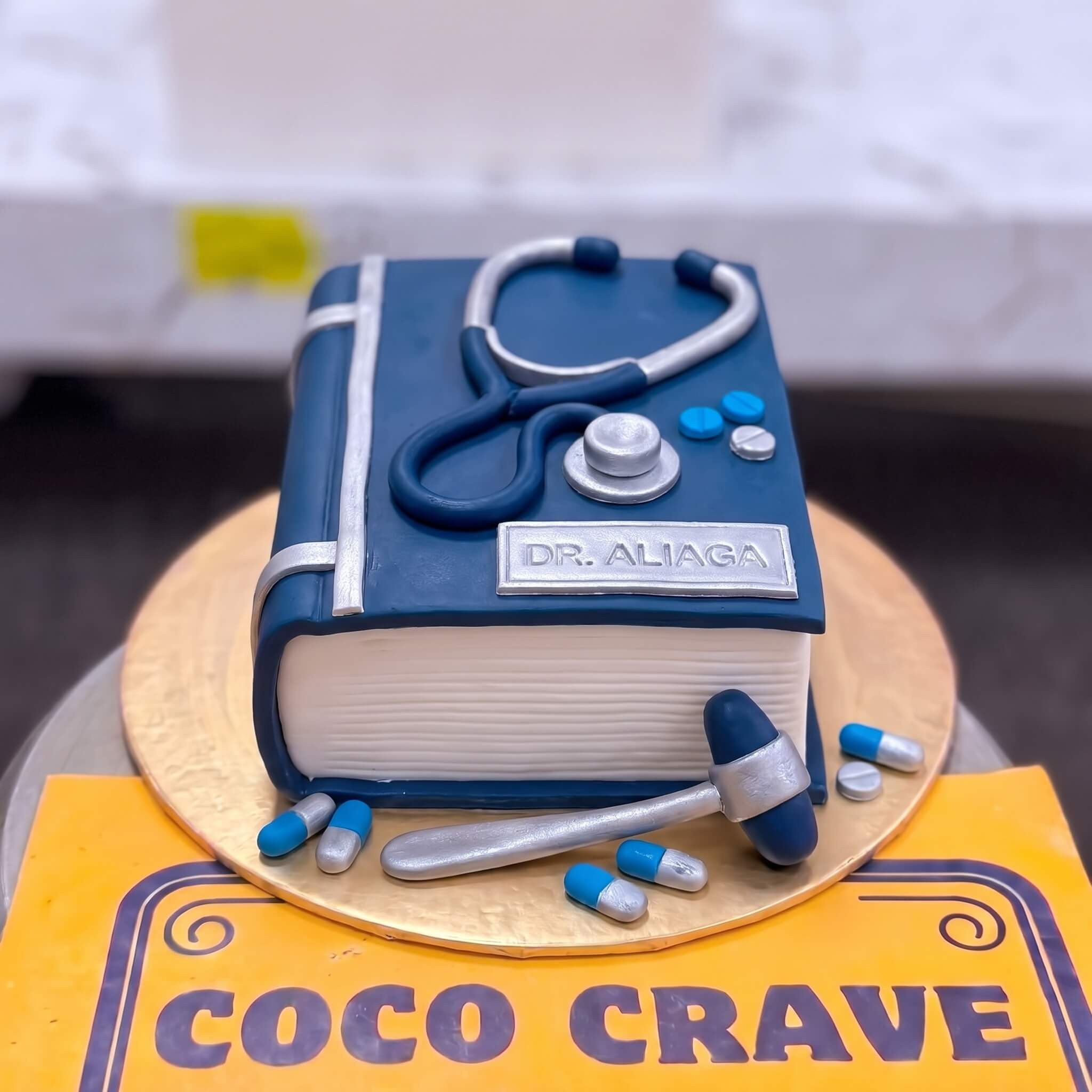Blue Doctor Scrubs and Stethoscope Cake in Lahore Blue Doctor Scrubs and Stethoscope Cake in Lahore — CocoCrave Lahore