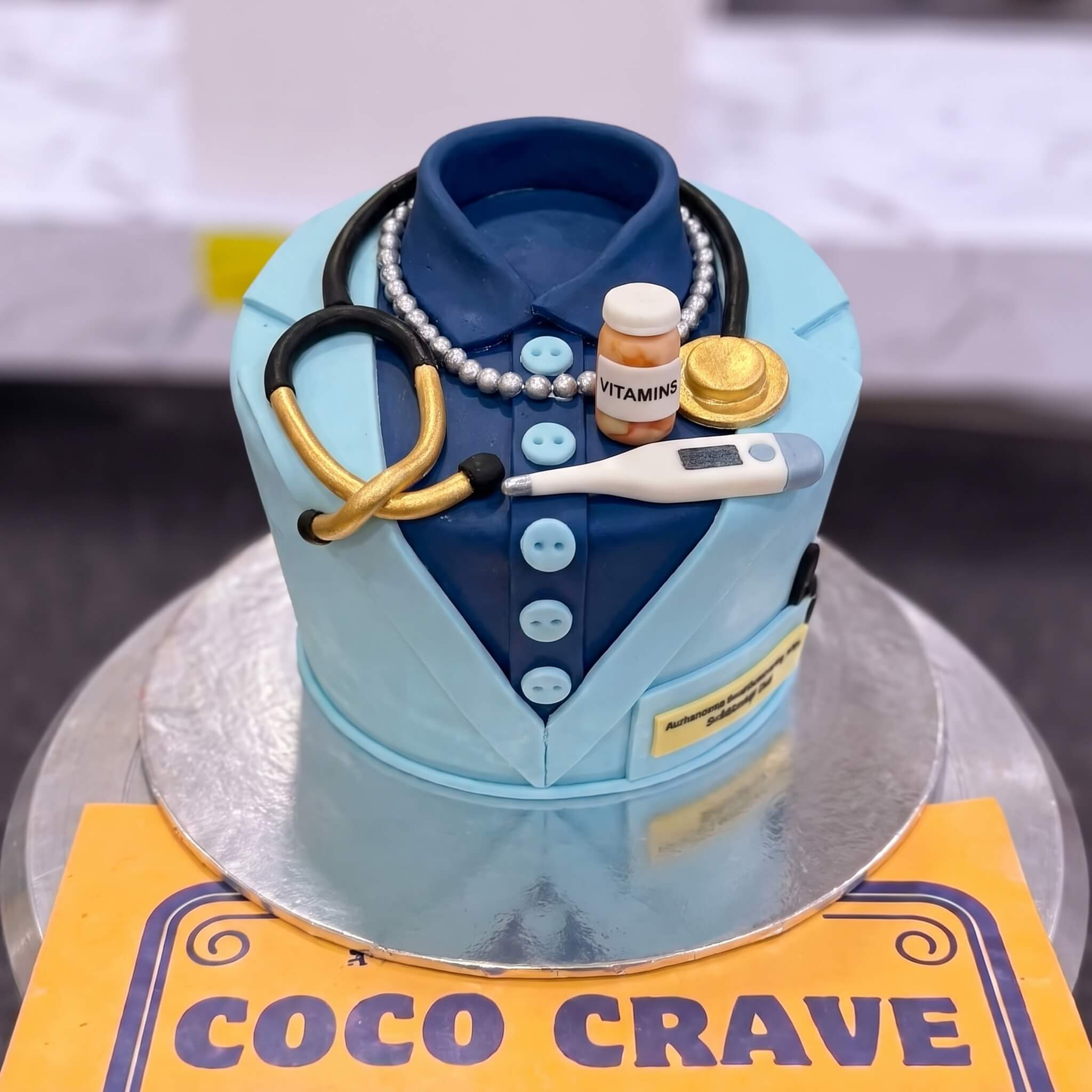 Blue Doctor Uniform and Medicine Cake in Lahore Blue Doctor Uniform and Medicine Cake in Lahore — CocoCrave Lahore