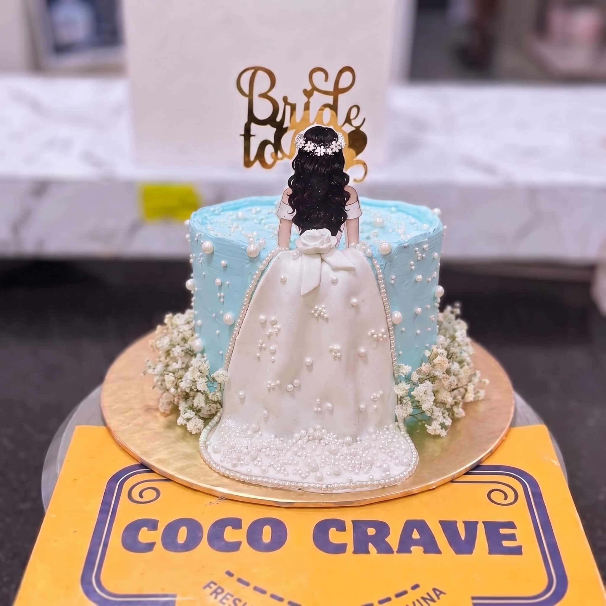 Blue Floral Bride Figurine Cake in Lahore Blue Floral Bride Figurine Cake in Lahore — CocoCrave Lahore