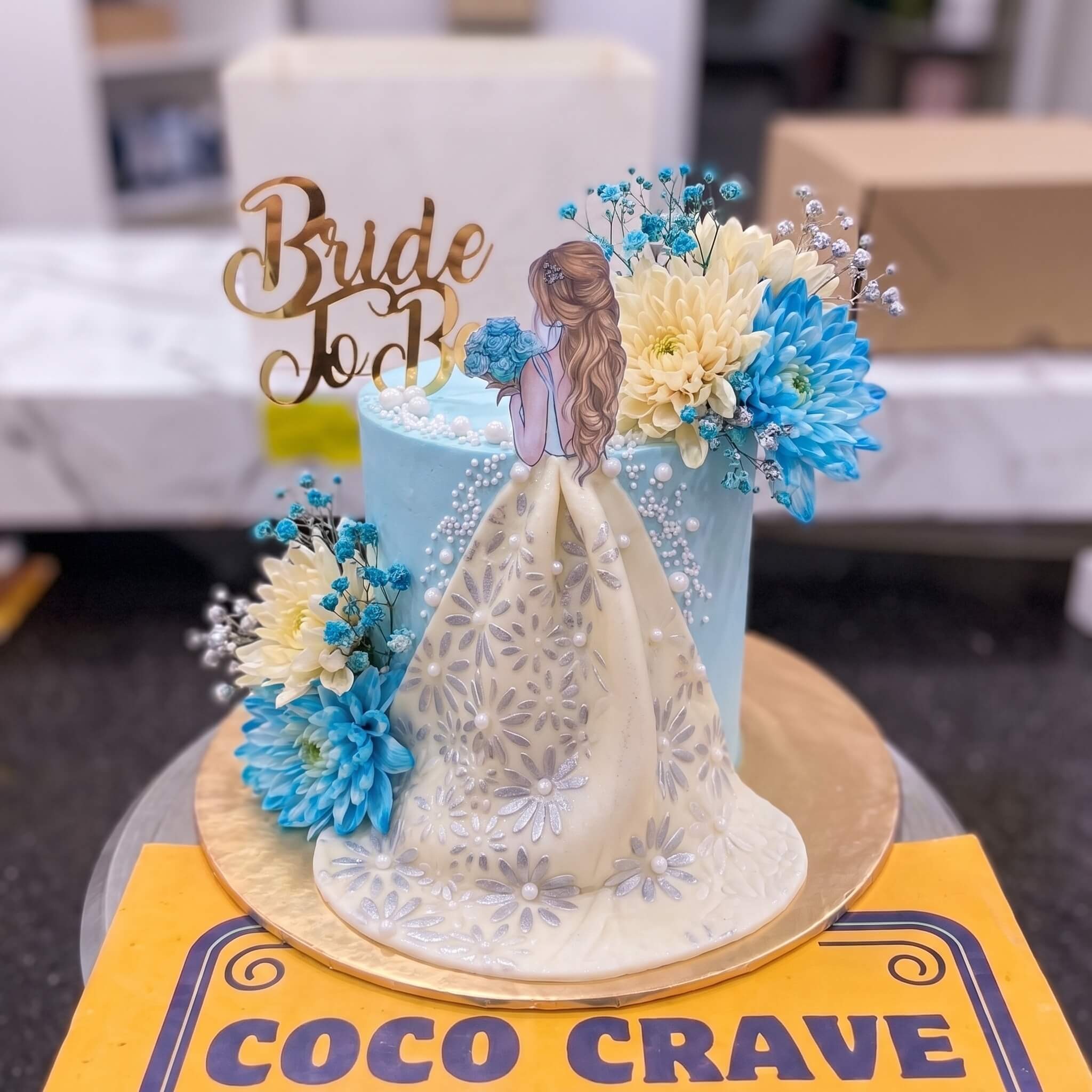 Blue Flower Bride Figurine Cake in Lahore Blue Flower Bride Figurine Cake in Lahore — CocoCrave Lahore