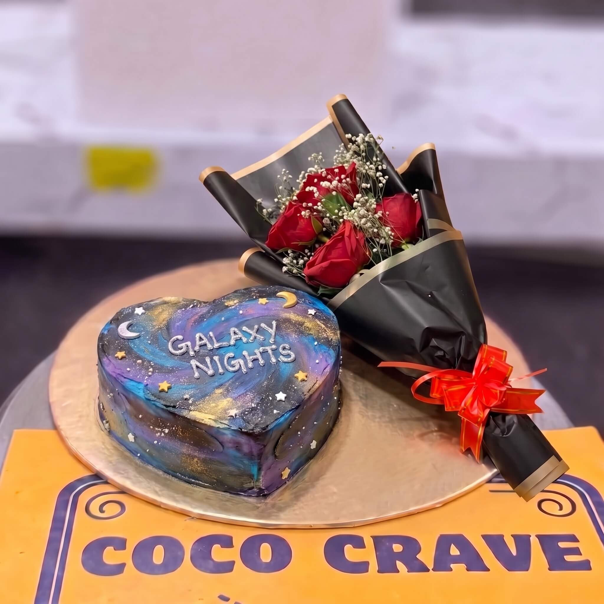 Blue Galaxy Cake and Red Rose Bouquet in Lahore Blue Galaxy Cake and Red Rose Bouquet in Lahore — CocoCrave Lahore