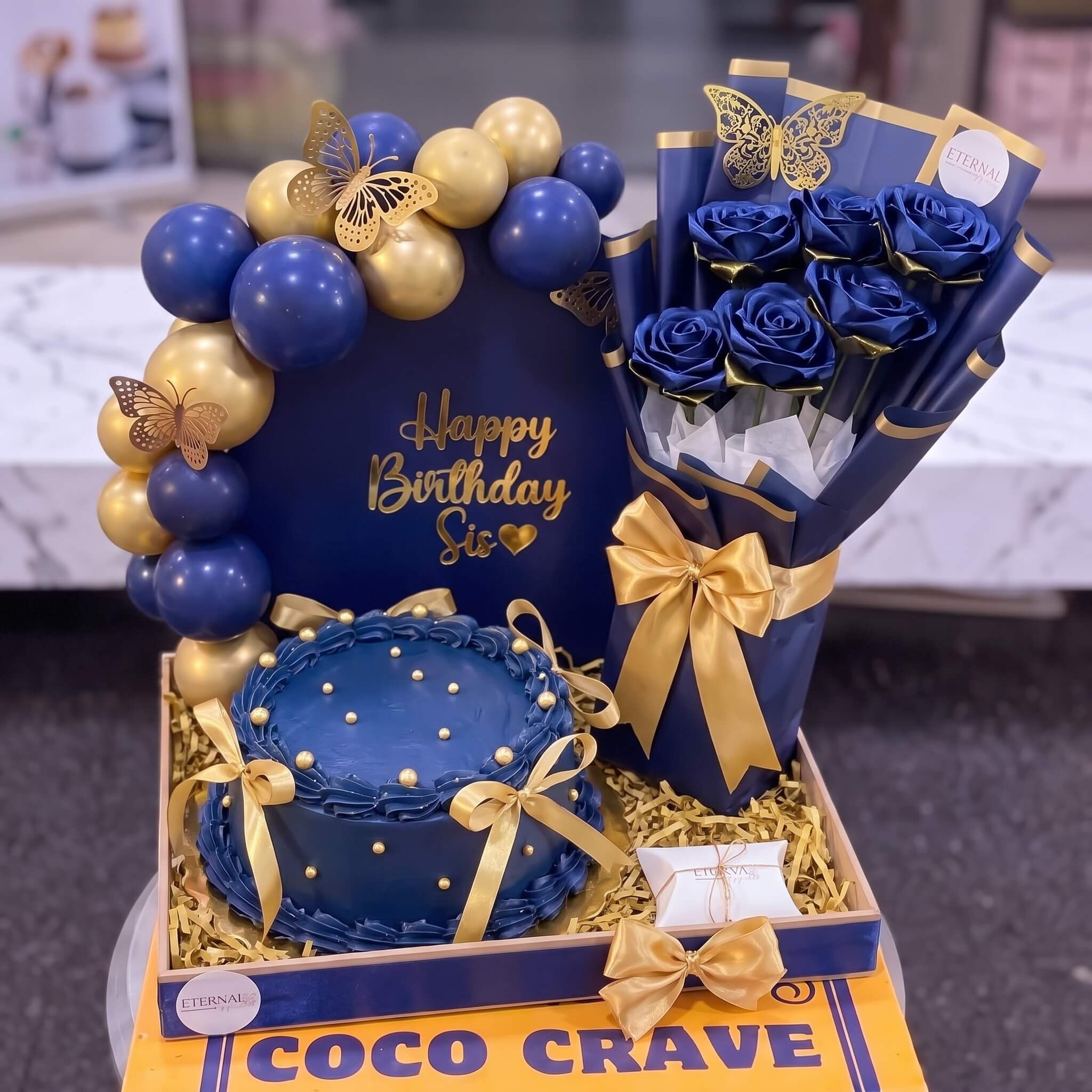 Blue Gold Cake with Rose Bouquet and Balloons in Lahore Blue Gold Cake with Rose Bouquet and Balloons in Lahore — CocoCrave Lahore