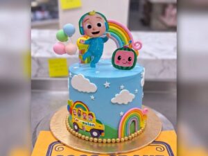 Blue Rainbow Cartoon Birthday Cake in Lahore — CocoCrave Lahore