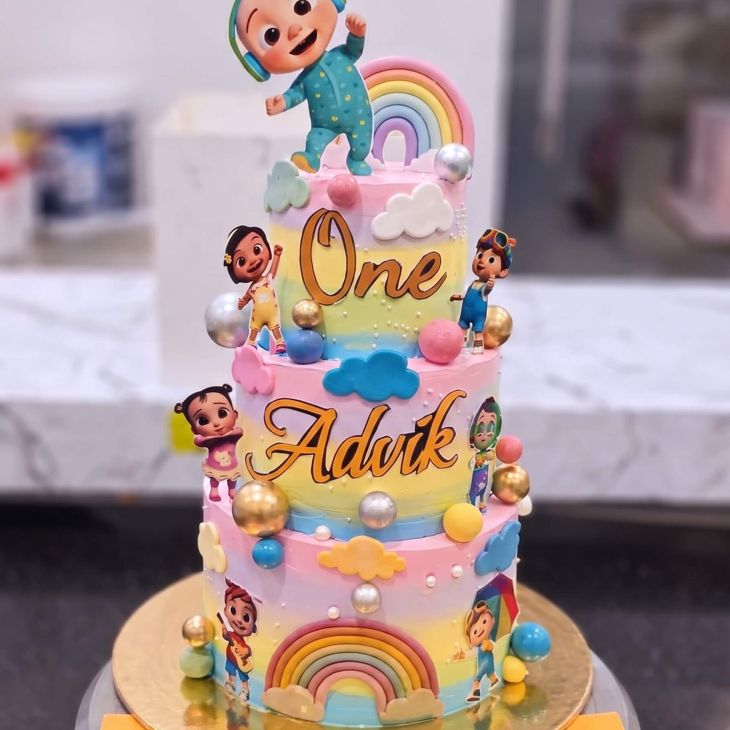 Cocomelon Three Tier Rainbow Cake in Lahore Cocomelon Three Tier Rainbow Cake — CocoCrave.pk Lahore