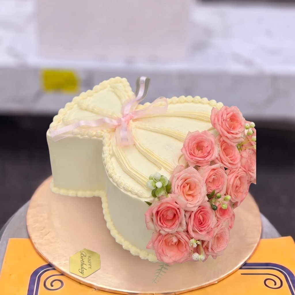 Cream Heart Cake with Pink Roses in Lahore Cream Heart Cake with Pink Roses by CocoCrave.pk in Lahore