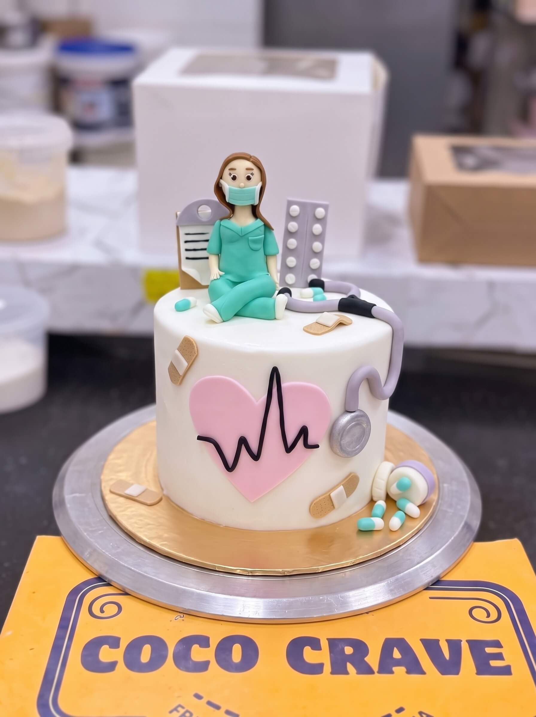 Lady Doctor Cake in Lahore — CocoCrave.pk Lady Doctor Cake in Lahore by CocoCrave.pk — single tier lady doctor cake in white and red
