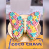 Floral Rainbow Butterfly Cake in Lahore 1 Floral rainbow butterfly cake with pink, blue and yellow rosettes — CocoCrave Lahore