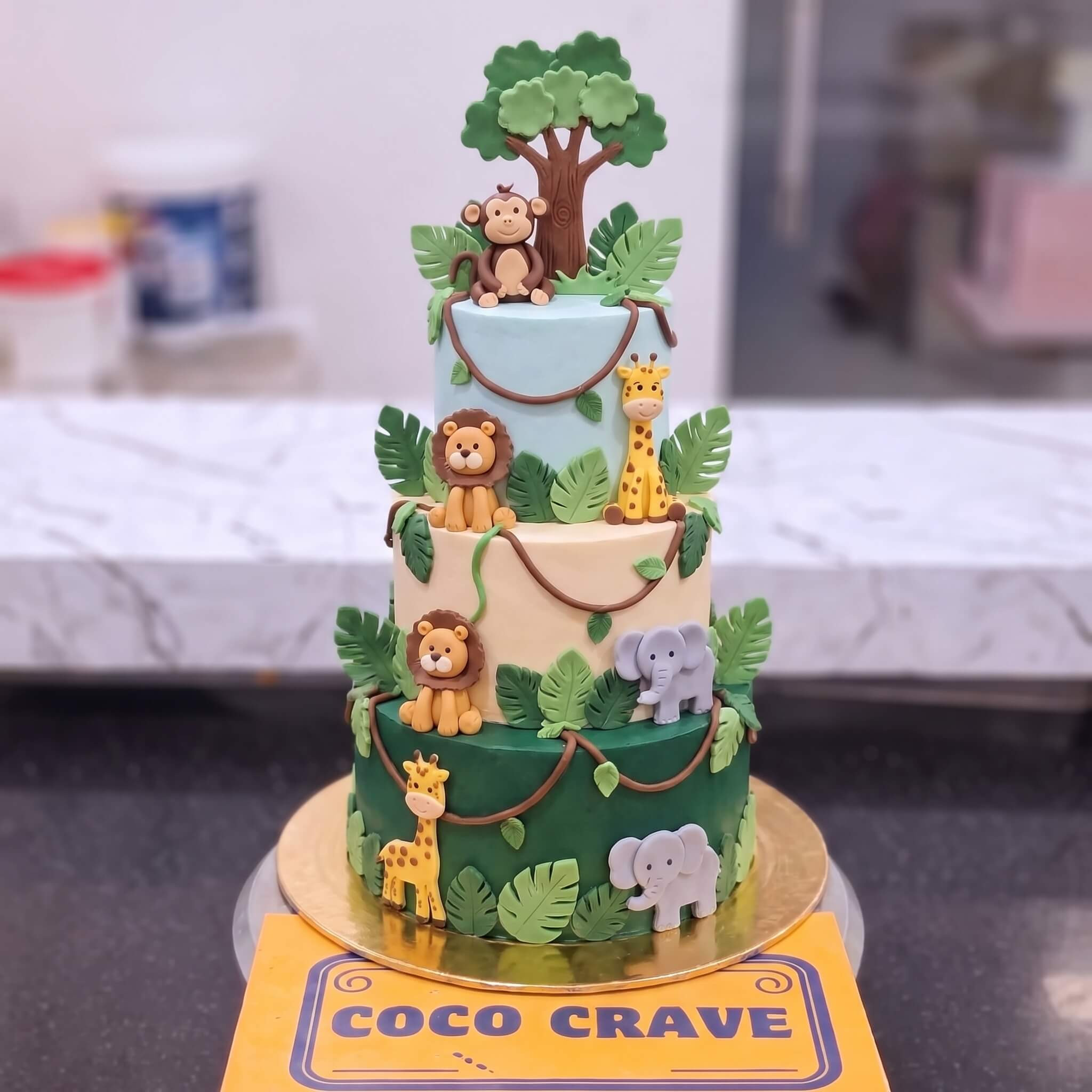Green Jungle Animals Three Tier Cake in Lahore Green Jungle Animals Three Tier Cake in Lahore — CocoCrave Lahore