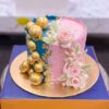 Half Blue Half Pink Cake with Gold Spheres by CocoCrave.pk in Lahore