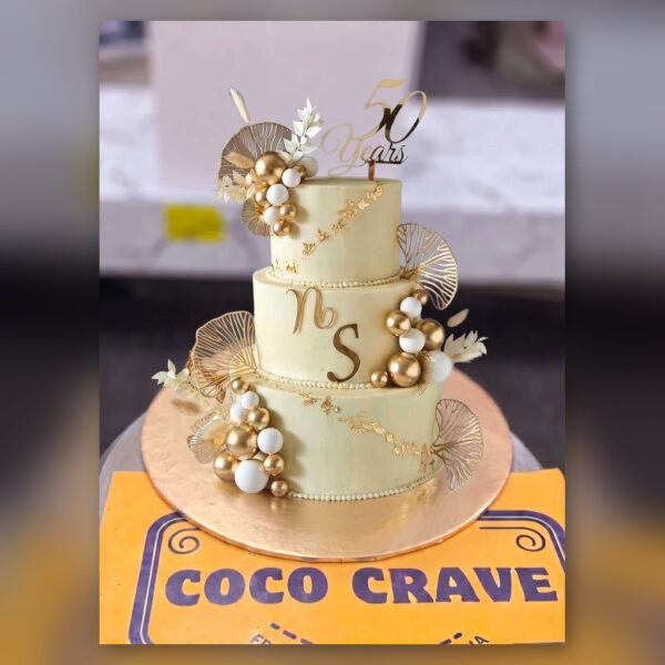Ivory and Gold 50 Years Anniversary Cake in Lahore — delivered in Lake City, Lahore