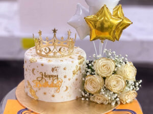 Ivory Crown Cake with White Bouquet and Balloons in Lahore