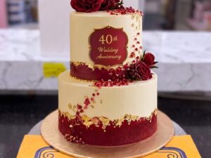 Ivory Two Tier Ruby Anniversary Cake in Lahore — CocoCrave Lahore