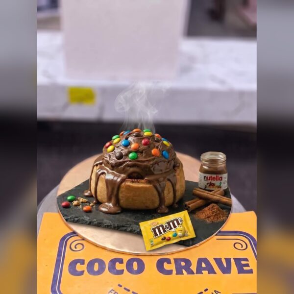 Nutella and M&Ms Loaded Cinnamon Roll in Lahore — delivered in Lake City, Lahore