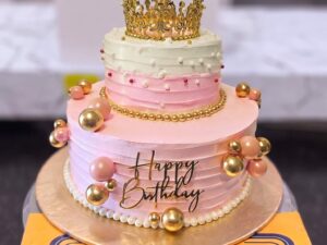 Pastel Pink Two Tier Crown Birthday Cake in Lahore — CocoCrave Lahore