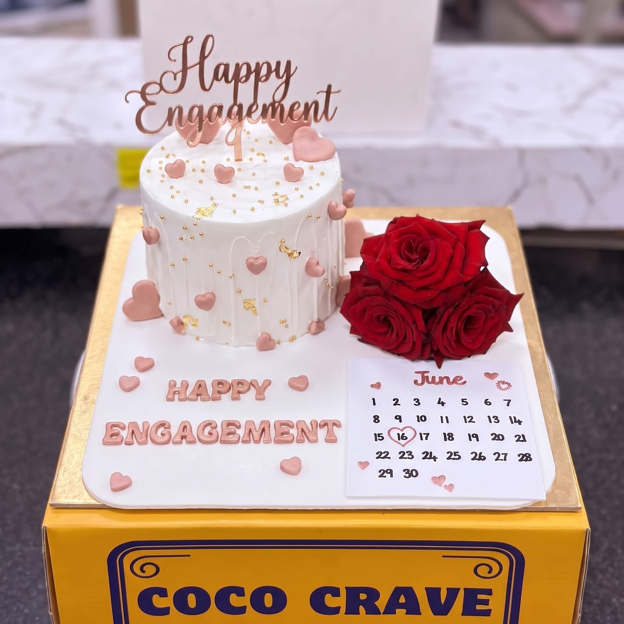 Pink Engagement Calendar Cake with Red Roses in Lahore Pink Engagement Calendar Cake with Red Roses in Lahore — CocoCrave Lahore