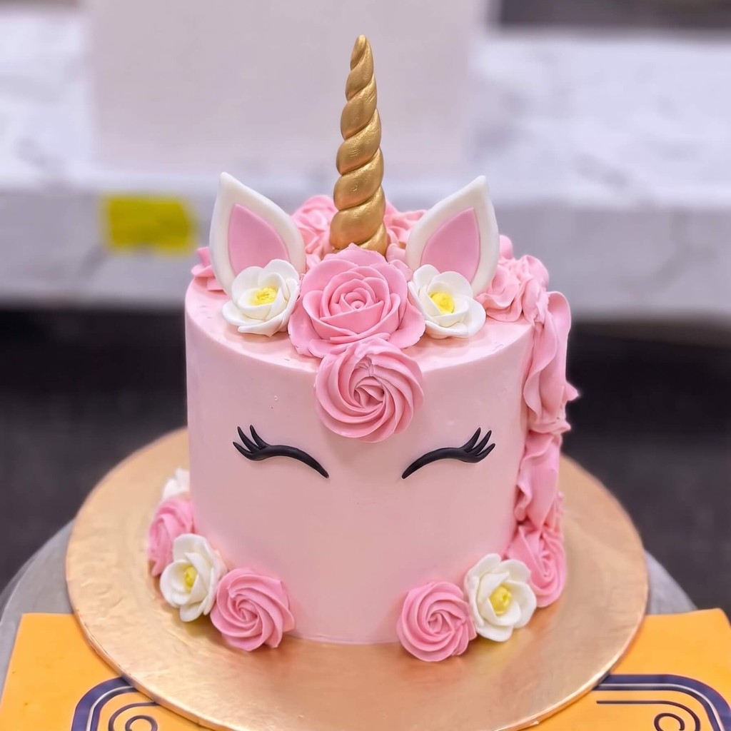 Pink Unicorn Face Cake with Roses in Lahore — CocoCrave.pk Pink Unicorn Face Cake with Roses in Lahore by CocoCrave.pk — single tier unicorn cake in Pink