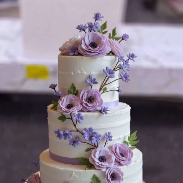 Purple Floral Three Tier Cake in Lahore — delivered in Eme Society, Lahore