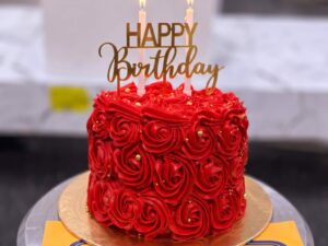 Red Rosette Candle Birthday Cake in Lahore