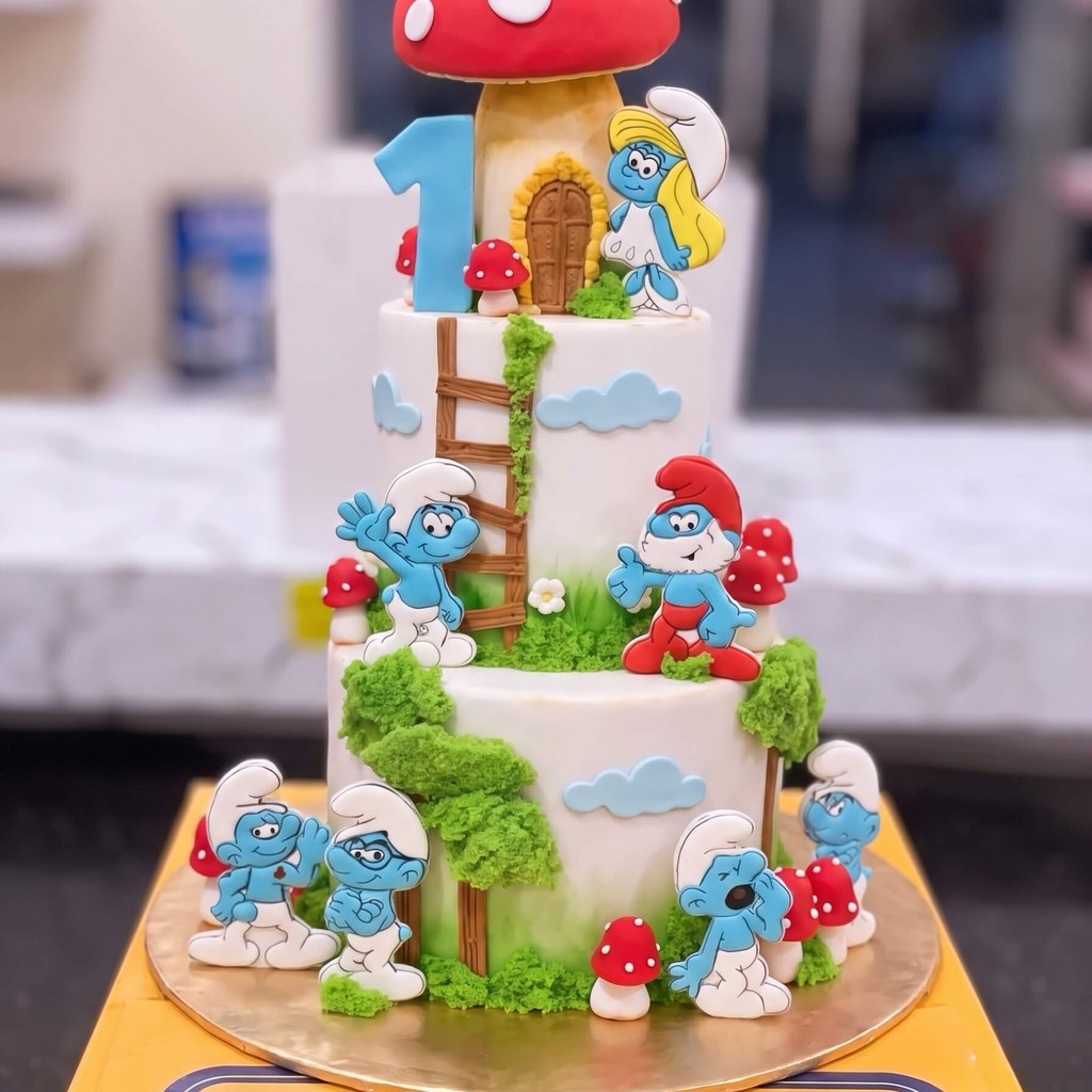 Three Tier Smurfs Cake in Lahore Three Tier Smurfs Cake by CocoCrave.pk in Lahore