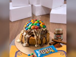 Triple Fusion Vanilla Nutella M&Ms Cinnamon Roll in Lahore — delivered in Nfc Housing Society, Lahore
