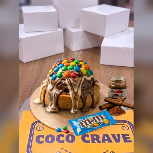 Triple Fusion Vanilla Nutella M&Ms Cinnamon Roll in Lahore — delivered in Lake City, Lahore