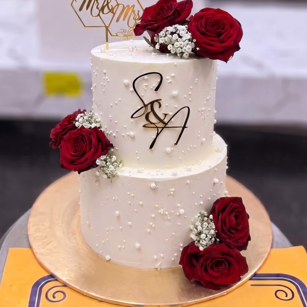 Two Tier White Cake with Red Roses in Lahore Two Tier White Cake with Red Roses by CocoCrave.pk in Lahore