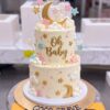 Oh Baby Stars and Moon Cake in Lahore 1 Oh Baby Stars and Moon Cake in Lahore by CocoCrave.pk — two tier stars and moon baby shower cake in cream, gold and pastel