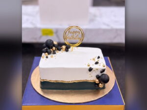 White and Black Cake with Gold Spheres in Lahore