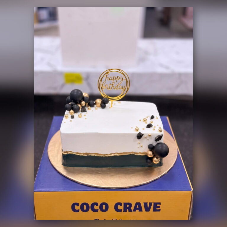 White and Black Cake with Gold Spheres in Lahore