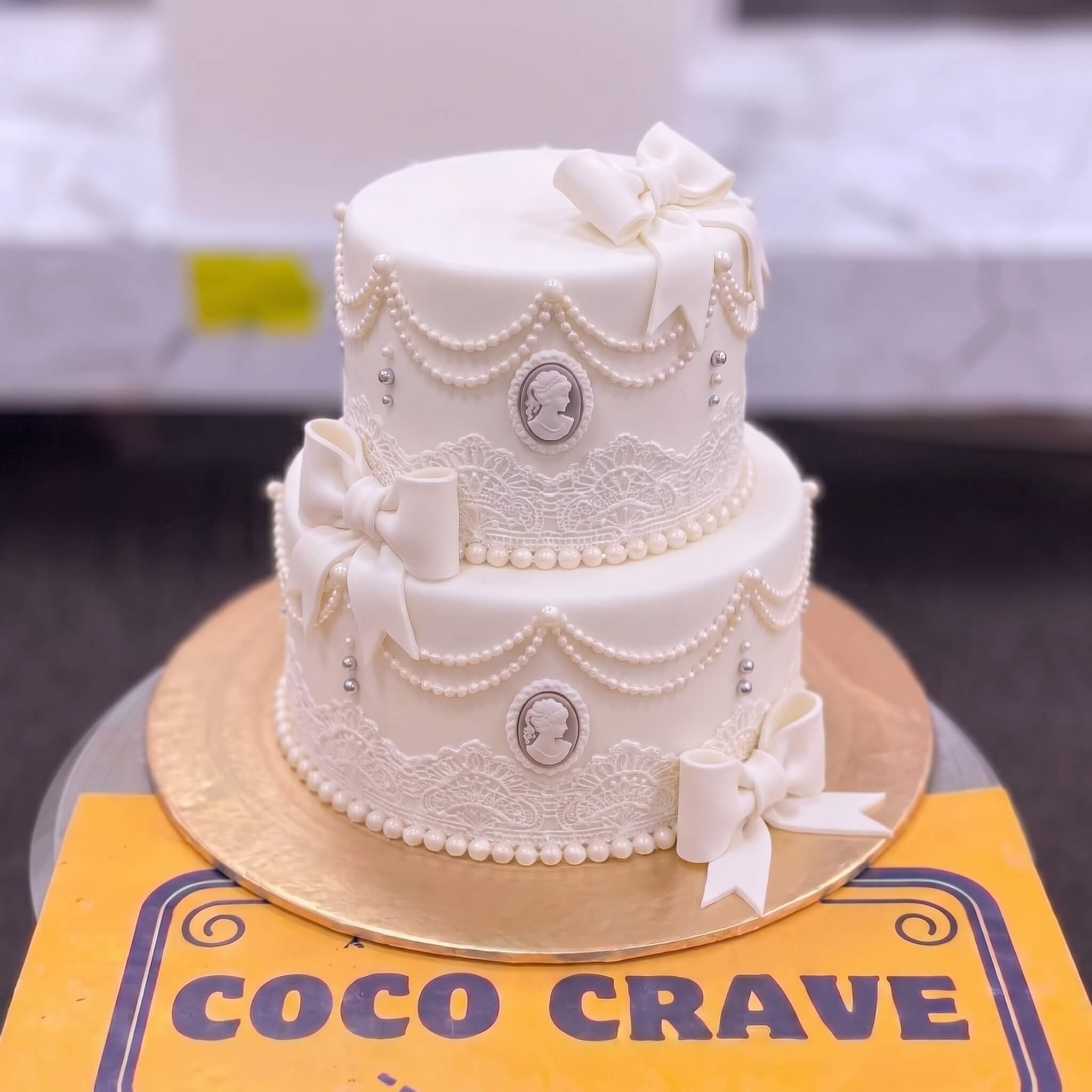 White Bow Two Tier Celebration Cake in Lahore White Bow Two Tier Celebration Cake in Lahore — CocoCrave Lahore