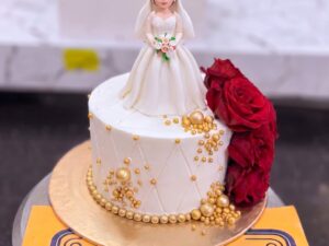 White Bride Cake with Red Rose Dress in Lahore