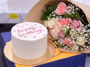 White Celebration Cake with Pink Rose Bouquet in Lahore