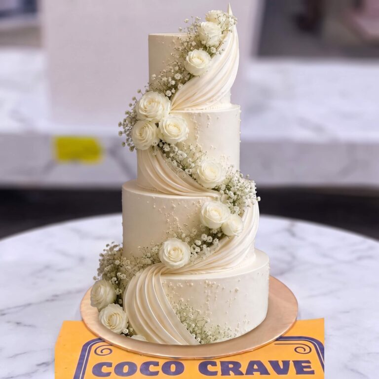 White Drape and Rose Four Tier Walima Cake in Lahore