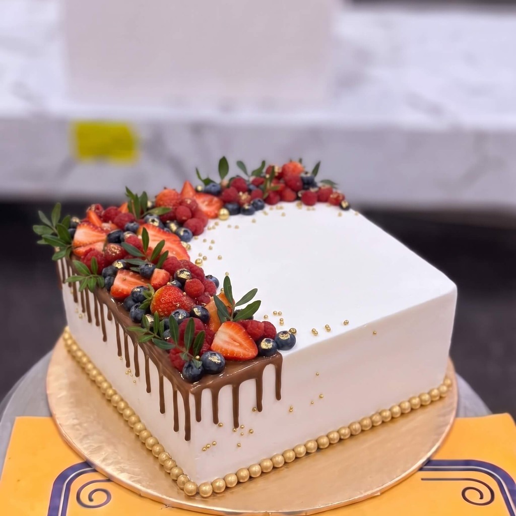 White Drip Cake with Strawberries in Lahore White Drip Cake with Strawberries by CocoCrave.pk in Lahore