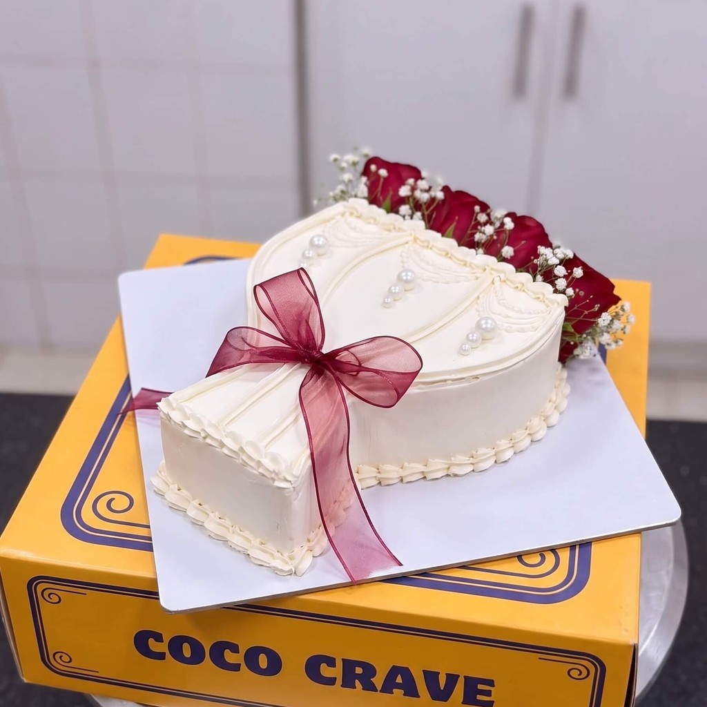 White Gift Box Cake with Pink Ribbon in Lahore White Gift Box Cake with Pink Ribbon by CocoCrave.pk in Lahore